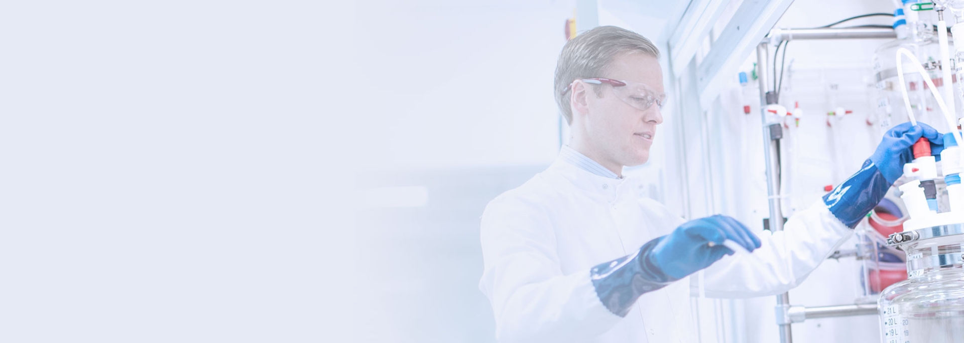 A close up taken of a Caucasian man working with scientific equipment.